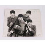 Beatles autographs, a photograph of the four members signed in pen. The vendor states "The picture