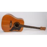 An Italian made Eko six string acoustic guitar