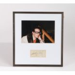 Buddy Holly autograph, with a photograph of Buddy Holly above the signed slip