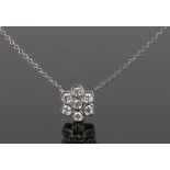 Tiffany diamond and platinum pendant necklace, with a diamond set flower head pendant, the