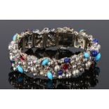 18 carat white gold ruby turquoise and lapis lazuli bracelet, attributed to Stuart Devlin, with