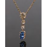 Diamond and sapphire pendant necklace, with an estimated total diamond weight of 1 carat above a