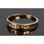 18 carat gold and diamond ring, the five diamonds inset into the shank, ring size M 1/2