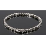 18 carat gold diamond set bracelet, with a row of round cut diamonds at an estimated 2.75 carats,