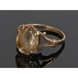 9 carat gold smoky quartz ring, with an oval facetted stone, ring size N 1/2