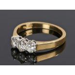 18 carat gold diamond set ring, with three brilliant cut diamonds to the head totalling 0.63