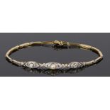 Diamond and pearl set bracelet, with a central pearl and diamond surround trailing to the linked