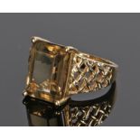 9 carat gold smoky quartz ring, the emerald cut quartz with lattice shoulders, ring size P