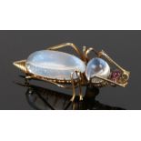 Moonstone set insect brooch, of a bug with cabochon red eyes and yellow metal body, 36mm long