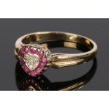 9 carat gold ruby and diamond ring, the heart form head set with rubies and with diamonds to the