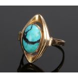 9 carat gold and turquoise set ring, the cabochon cut turquoise with an arched loop surround, ring