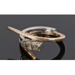 14 carat gold diamond set ring, with three baguette diamonds to the white and yellow gold