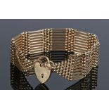 9 carat gold gate bracelet, with a padlock clasp and gate bracelet, 31 grams