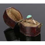18 carat gold and opal ring, the pear shaped opal raised between split shoulders, ring size Q