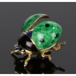 18 carat gold and enamel lady bird brooch, with green open wings and black head, 22mm long, 7.5