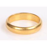 Gold coloured metal wedding band, unmarked, ring size L, 4.9g