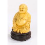 Oriental Buddha, seated position on a stand, 14cm high