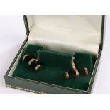 Pair of 9 carat gold cufflinks, with octagonal onyx and gold capped terminals, 9g gross