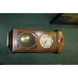 Walnut veneered wall clock, the silvered dial with Arabic numerals, 34cm wide, 77cm high