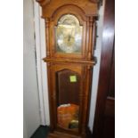 20th Century oak cased longcase clock, the hood with scroll carved pediment and arched bevelled