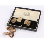 Two pairs of gold plated cufflinks, one pair decorated with St Christopher