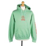 Ed Sheeran's Saint Pablo green hoodie with red print, size medium. All of the Ed Sheeran