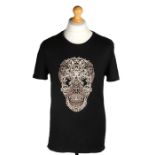 Ed Sheeran's Alexander McQueen black T-shirt, printed with a skull. All of the Ed Sheeran Collection