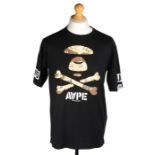 Ed Sheeran's Aape by A Bathing Ape black T-shirt, printed with a camouflage skull and crossbones,