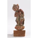 19th Century Balinese figure, polychrome painted as a bearded figure standing on a base, 12cm high