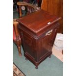 Mahogany coal scuttle, of tapering form, the panelled fall front opening to reveal a lined interior,