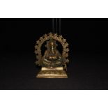 Brass deity figure depicting a seated Ganesh, 15cm high