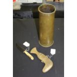 Second World War ammo shell, together with a Middle Eastern fish knife and an engraved knife (3)