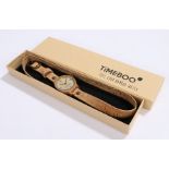 Timeboo bamboo wristwatch, the signed dial with baton markers, on a long cork bracelet, the case