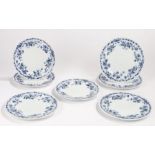Set of seven Brown Westhead Moore & Co plates, with blue and white foliate and tied ribbon