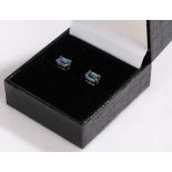 Pair of 9 carat white gold earrings set with a baguette cut topaz type stone
