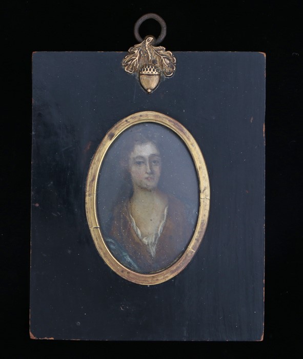 Late 17th Century portrait miniature of a lady, housed in an ebonised frame with gilt slip and acorn