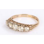 9 carat gold ring set with graduated clear paste, ring size O 1/2, 2.7g