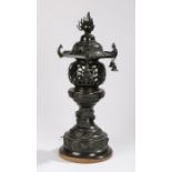 Chinese bronze Pagoda form lamp, with dragon and turtle decoration above the plinth base, 51cm high