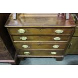 George III mahogany chest of four long drawers, the brass handles with gadrooned oval backplates,