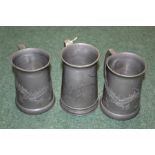 Three pewter tankards, with dragon decoration and glass bases, stamped Hoikee and Wahiee, AF (3)