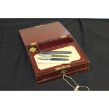 20th Century leather writing box, to include an Osmiroid 65 fountain pen, three Parker pens and an