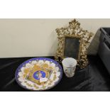 Porcelain plate decorated with a female head in profile, brass scroll decorated easel picture frame,