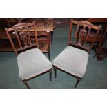 Pair of Edwardian walnut chairs, with pierced swag carved urn splat backs, over-stuffed seats, on