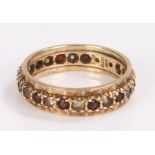 9 carat gold eternity ring, set with garnets and clear paste, ring size, ring size P, 3.4g