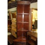 Old Charm oak standing corner cupboard, the scroll carved pediment above three shelves, frieze