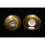 Pair of Lalaounis Greek silver and brass dishes, the silver centres with depiction of a wheat