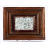 Chinese 19th Century ivory panel, cavred with figures among trees and buildings, framed, size