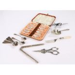 Cased set of six plated cake forks, nut crackers, grape scissors, tea strainer, corkscrew with pig