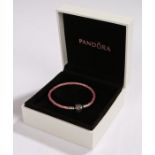 Pandora bracelet, the pink woven band with white metal clasp, housed in original box