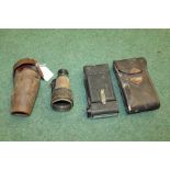 Cased monocular, the case in gold lettering Steward Strand London and a cased camera, both AF